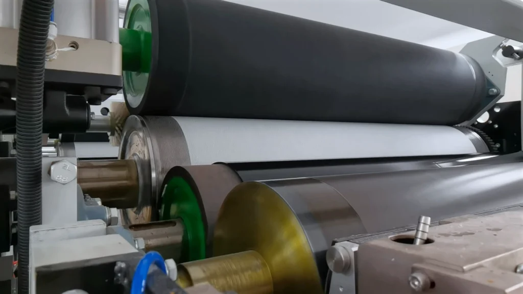 Complete automated V-Fold hand towel production line with jumbo roll unwinder and stacking system.