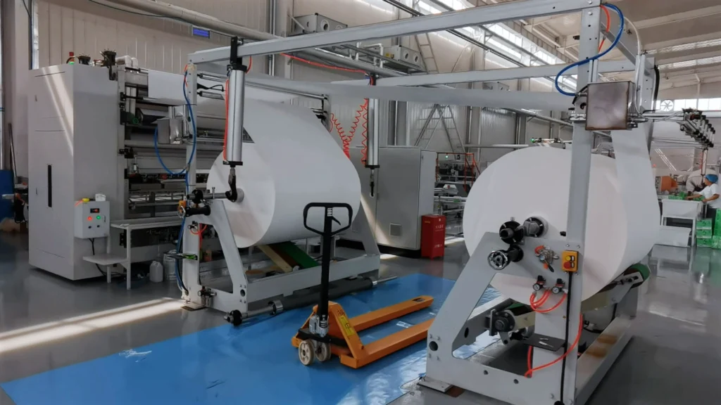 Heavy-duty unwinding system and vacuum folding technology for V-Fold hand towel production line TB-HTV2800-AT.